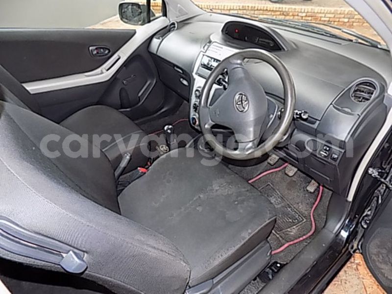 Big with watermark toyota yaris...